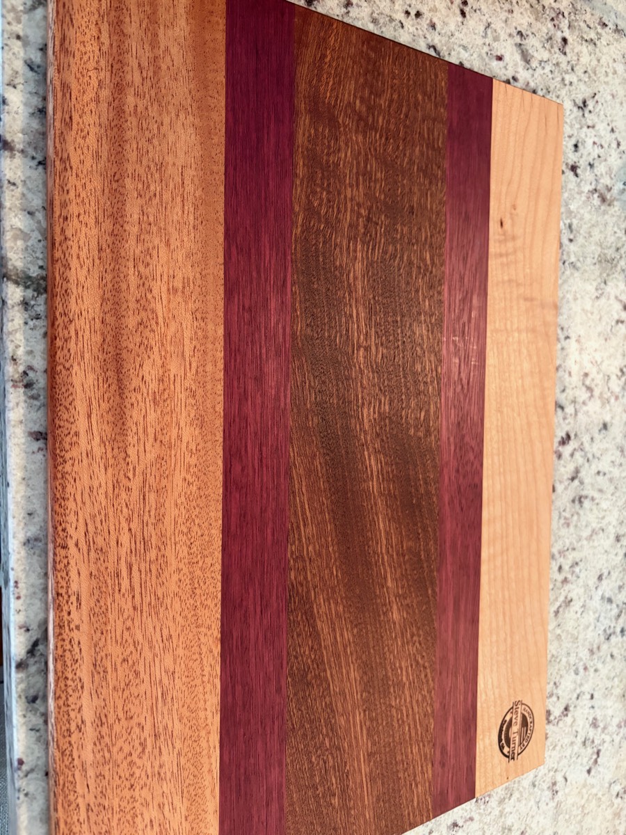 The Ember — mahogany, purpleheart, walnut, cherry cutting board